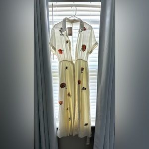 Long short sleeve dress. Material is thick but has pretty embroidery flowers